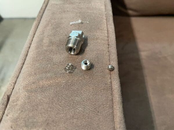 A couch with some parts missing on it