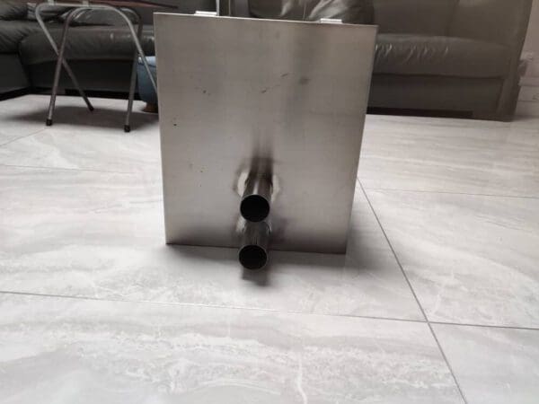 A metal object sitting on top of the floor.