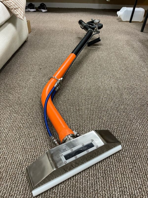 Carpet cleaning tool with a wand.