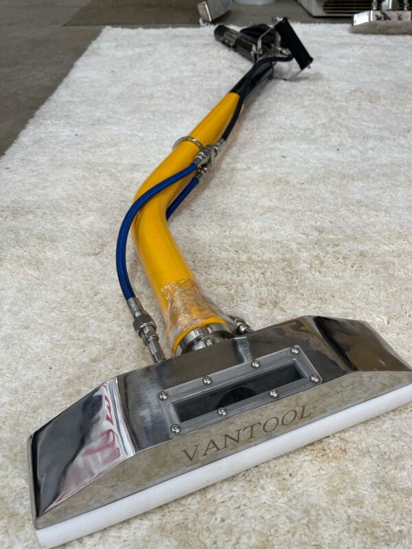 Vantool carpet cleaning wand on rug.