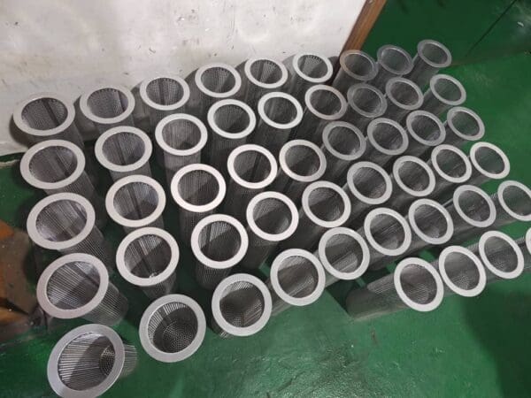 Many cylindrical metal mesh filters.