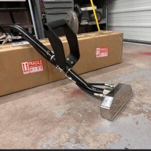 Black and silver floor cleaning tool.