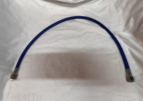 Blue braided hose with fittings.