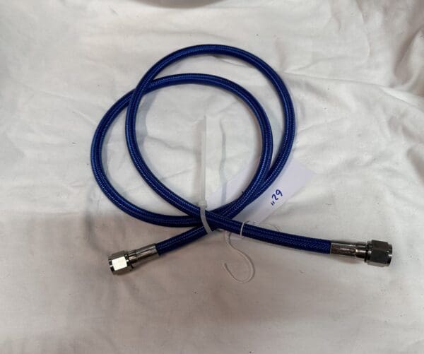 Blue braided hose with connectors.