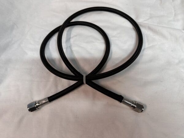 Black braided air hose with fittings.