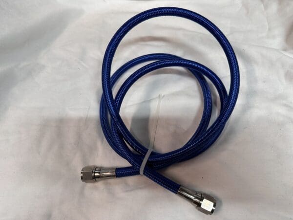 Blue braided hose with fittings.