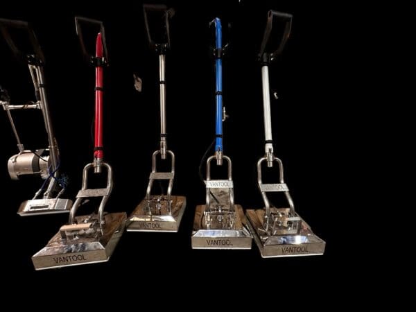 Five silver Vantool floor cleaning machines.