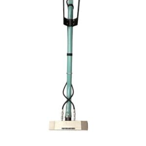 Green and black floor cleaning tool.