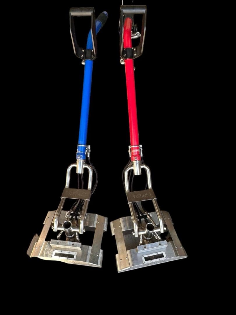 Two red and blue Vantool floor polishers.