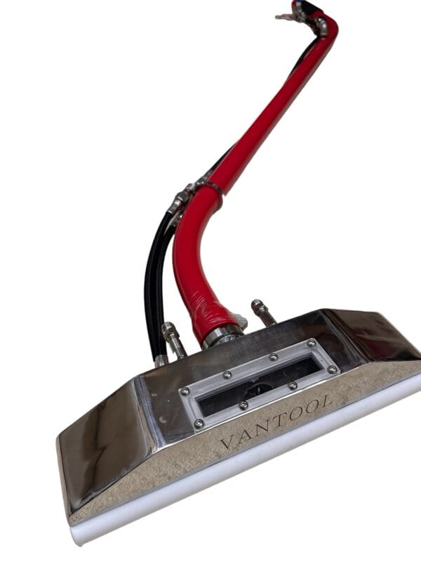 Vantool red and silver carpet cleaning tool.