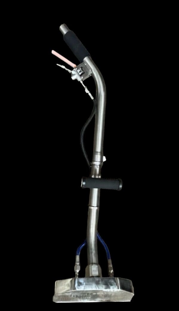 Stainless steel upholstery cleaning tool.