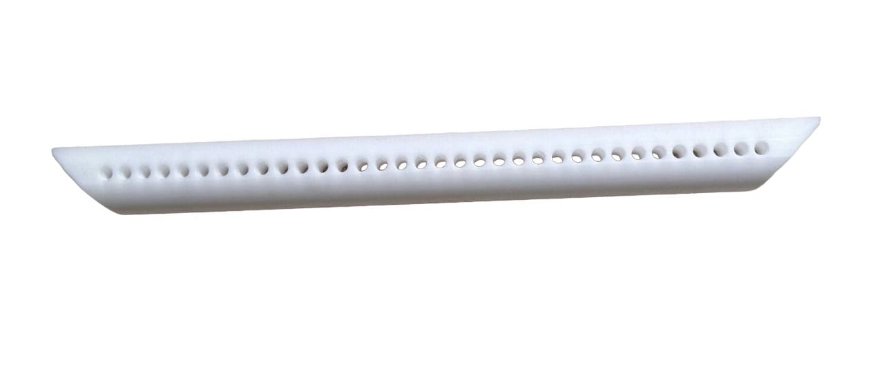 White plastic tube with holes.