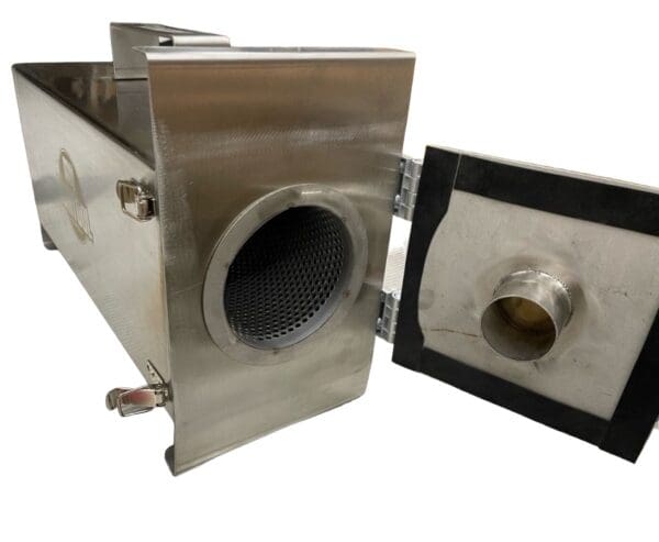 Stainless steel industrial furnace with door open.