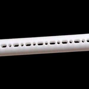 White plastic tube with holes.