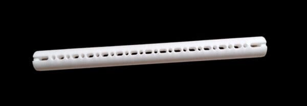 White plastic tube with holes.