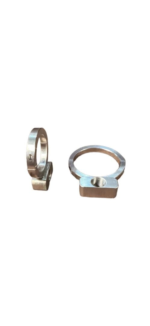 Two metal clamps with threaded holes.