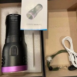 Purple light detection flashlight in box.