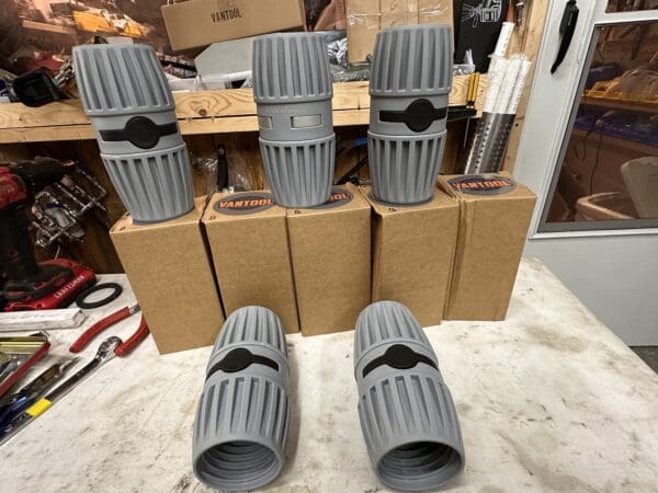 Five gray Vantool hose couplings.