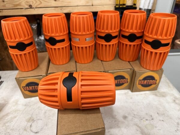 Orange and black tool connectors.