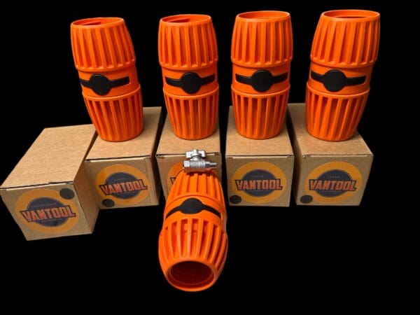 Orange Vantool pipe fittings on boxes.