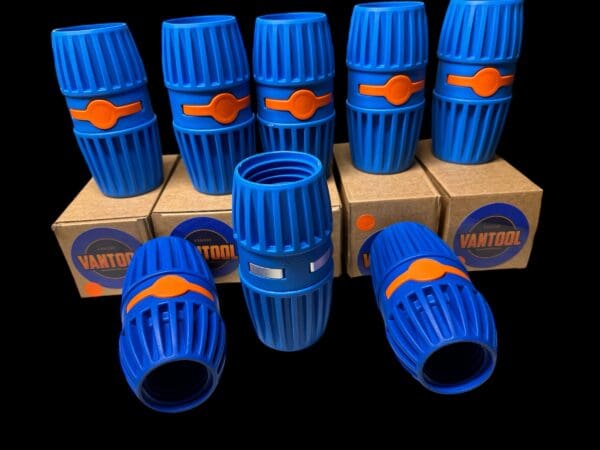 Blue and orange hose connectors on boxes.